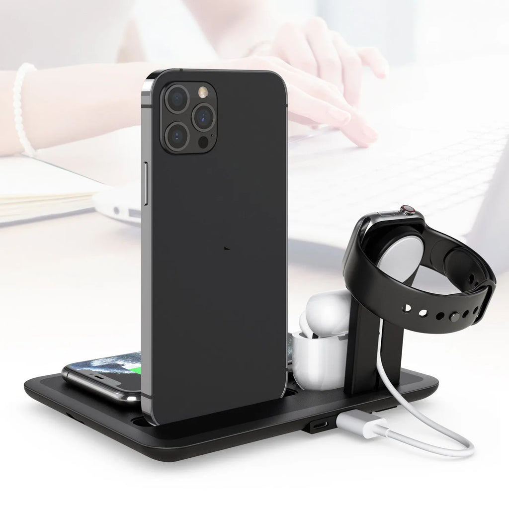Black and white desktop wireless charger with phone pad, watch port, and headphone bracket.