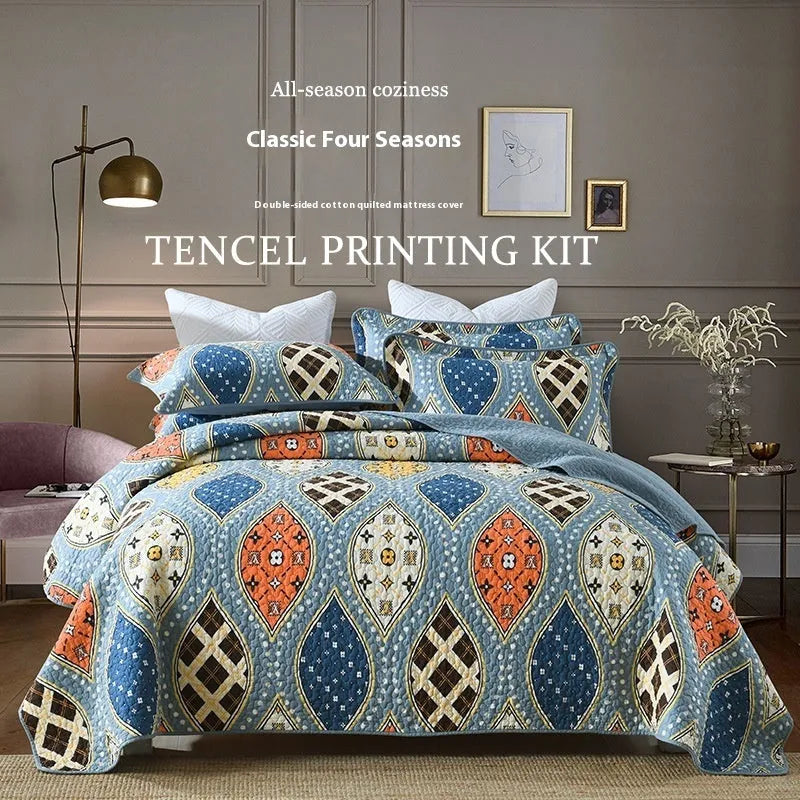 Quilted cotton bed cover set with printed pattern including bedspread and two pillowcases