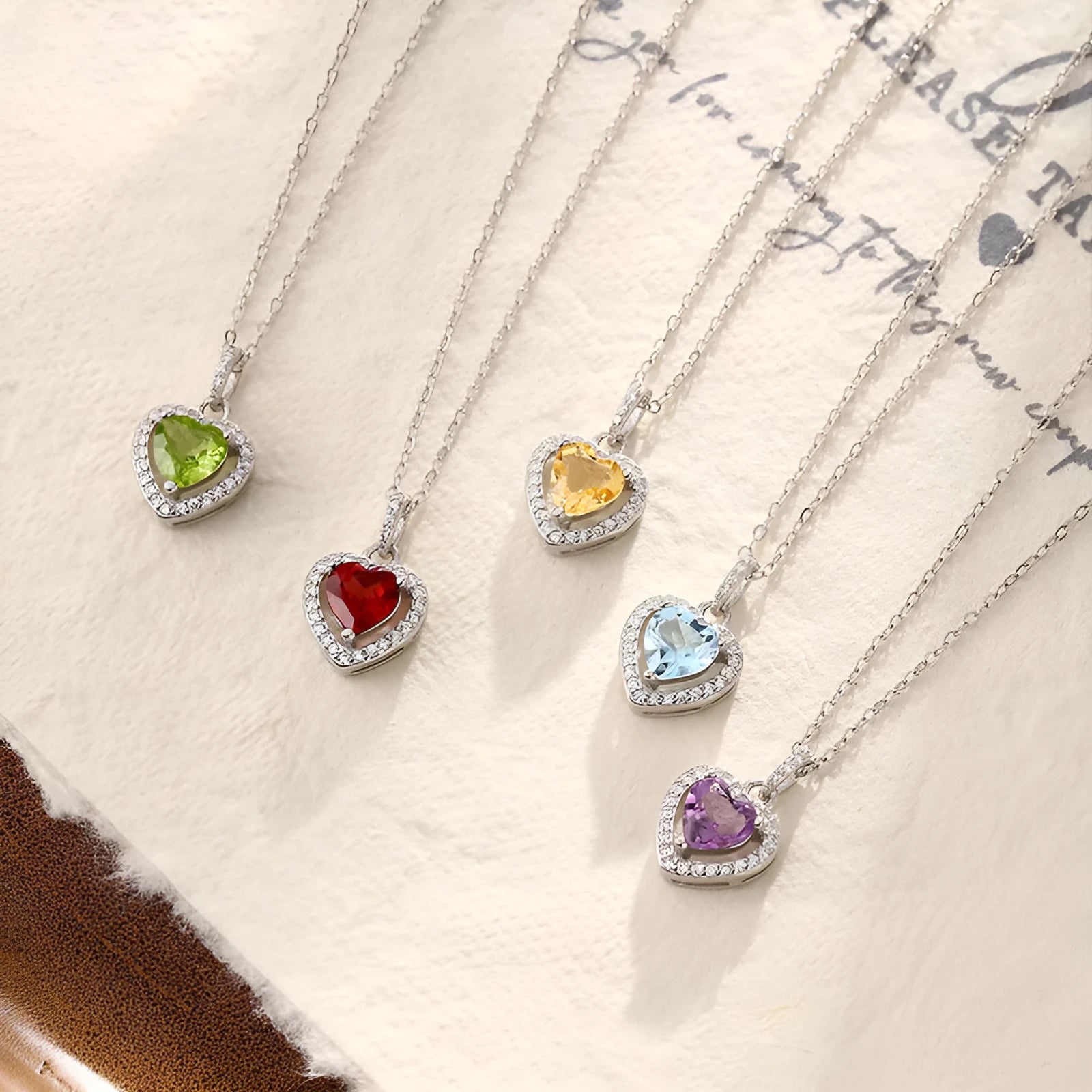 Women's sterling silver necklace with a heart-shaped amethyst pendant on an adjustable cross chain.