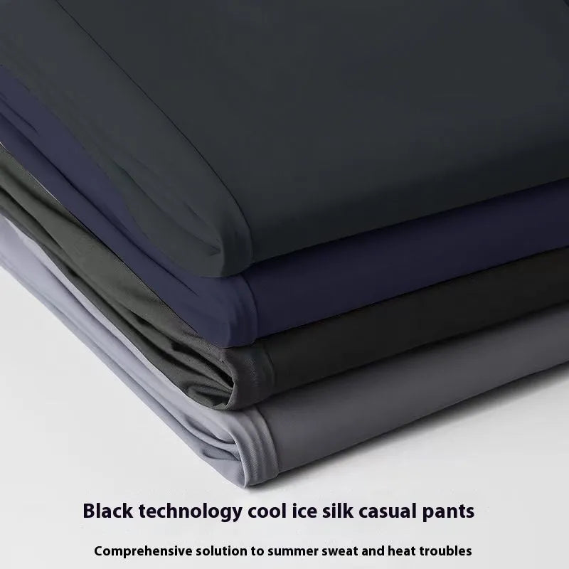 Man wearing black ice silk loose straight-leg trousers with a high elasticity open waist.