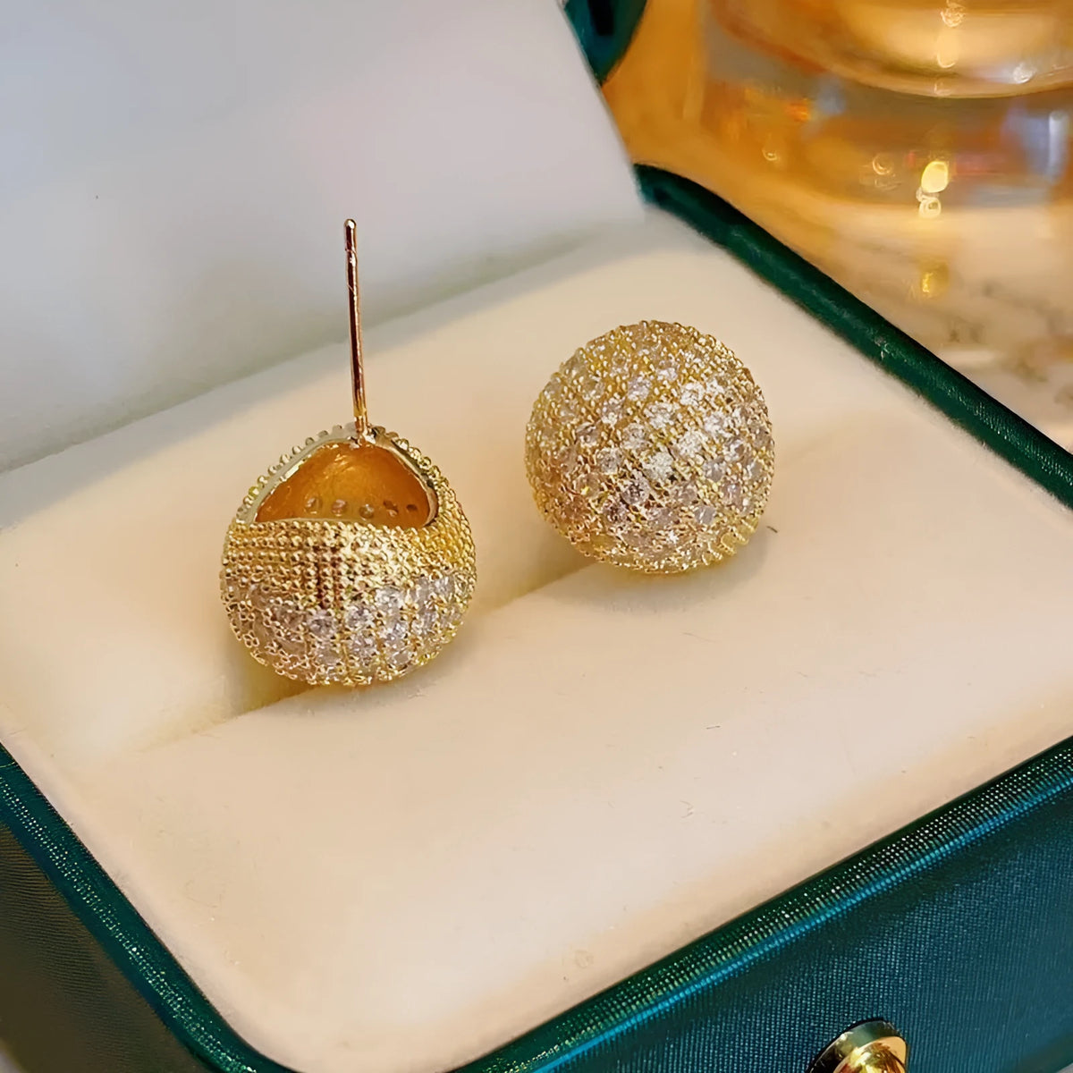 Gold and white geometric drop earrings with little golden beans design and ear clip fastening