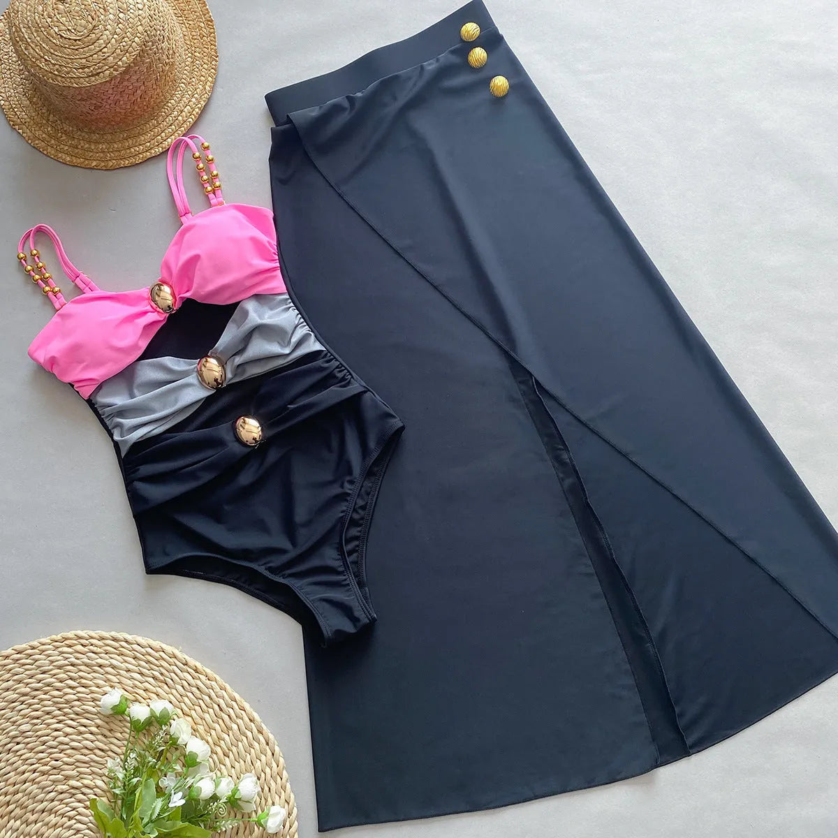Women's brown one-piece swimsuit with matching beige skirt on a hanger