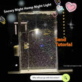 DIY snowy night light kit showing miniature street light and landscape with warm LED glow
