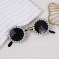 Round pearl sunglasses for a cat or dog, shown in blue on a neutral background.