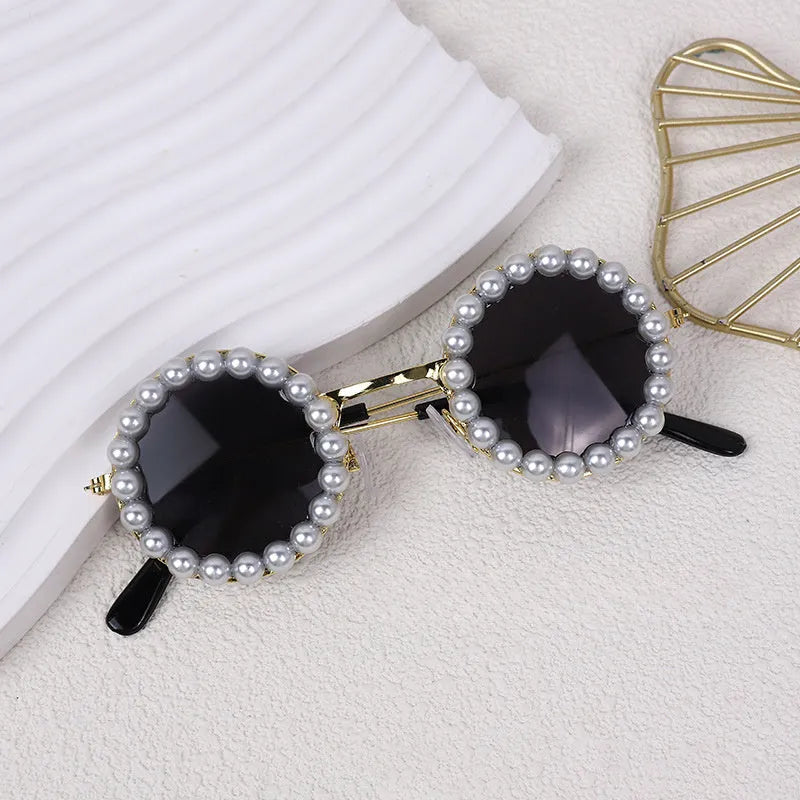 Round pearl sunglasses for a cat or dog, shown in blue on a neutral background.