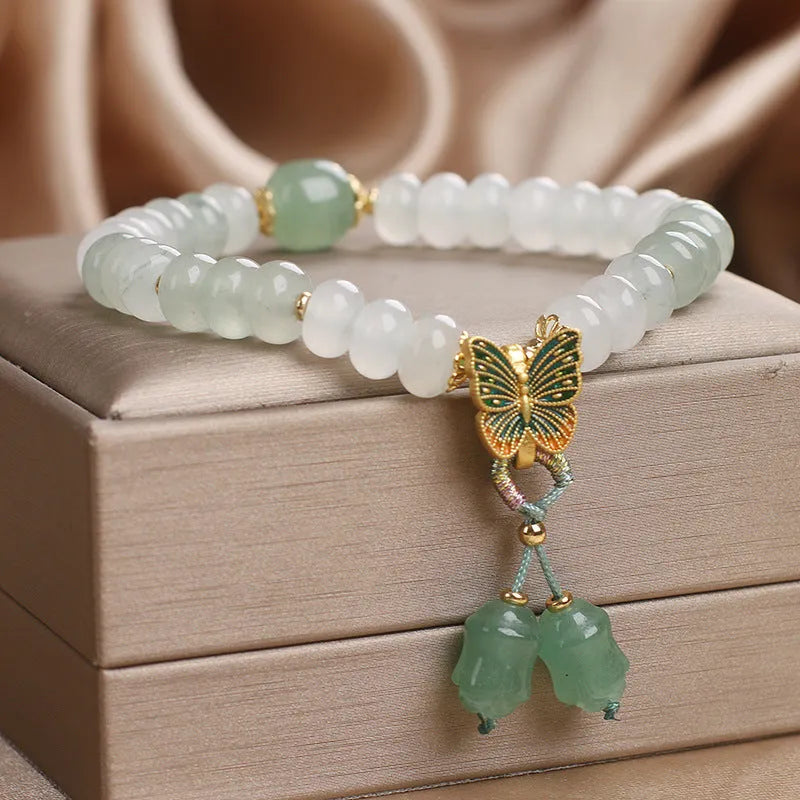 Green Tian Shan Cui abacus beads jade bracelet with butterfly tassel and pearl accents