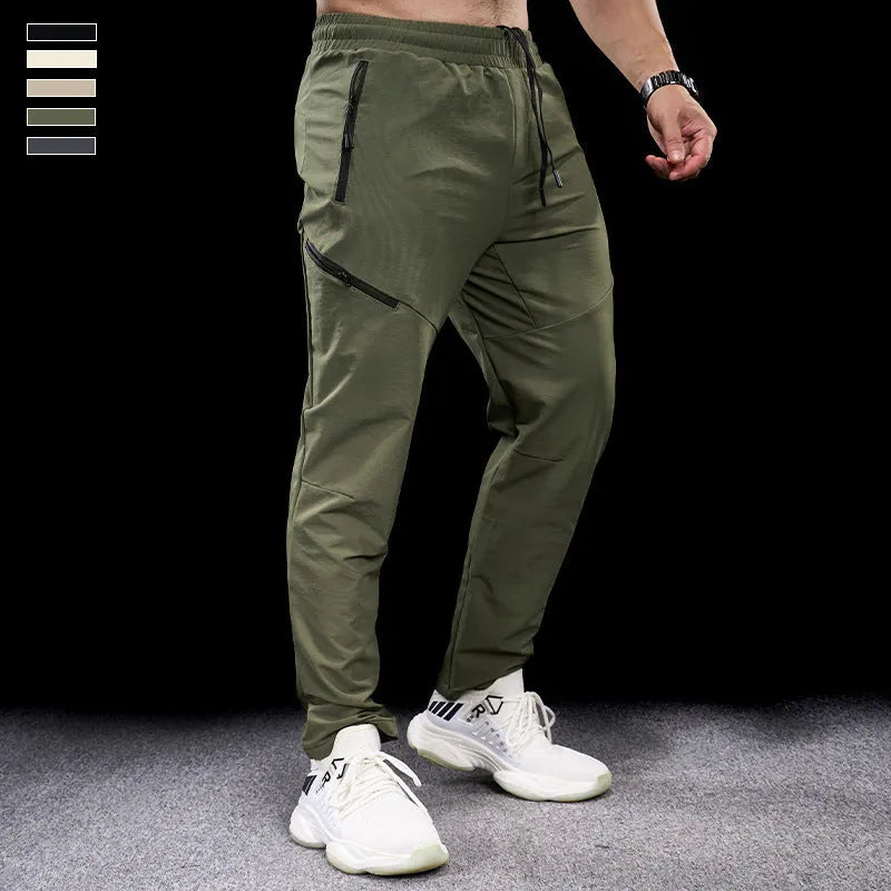 Men's waterproof quick-drying nylon workout pants in Army Green colour, showing mid waist design and trousers length