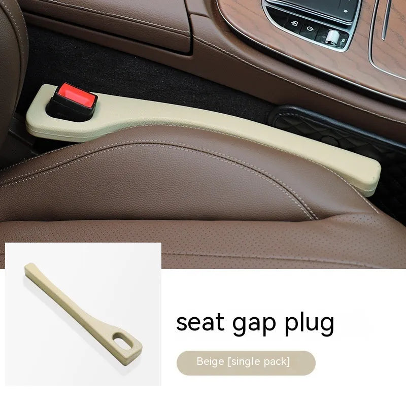 Polyurethane car seat gap filler strip in beige colour, placed between a car seat and centre console.
