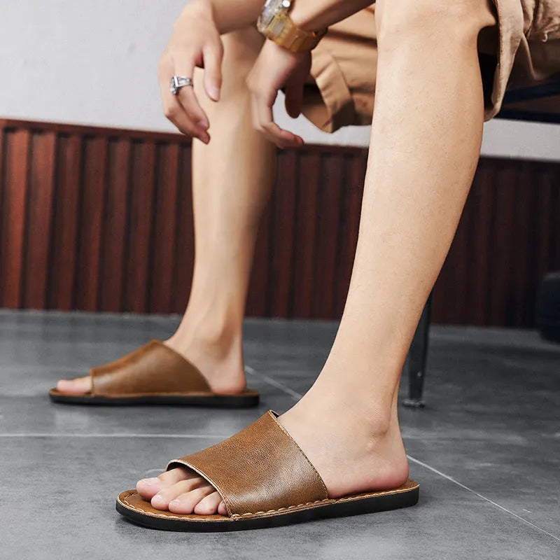 Men's brown leather outdoor sandals with a rubber sole on a white background
