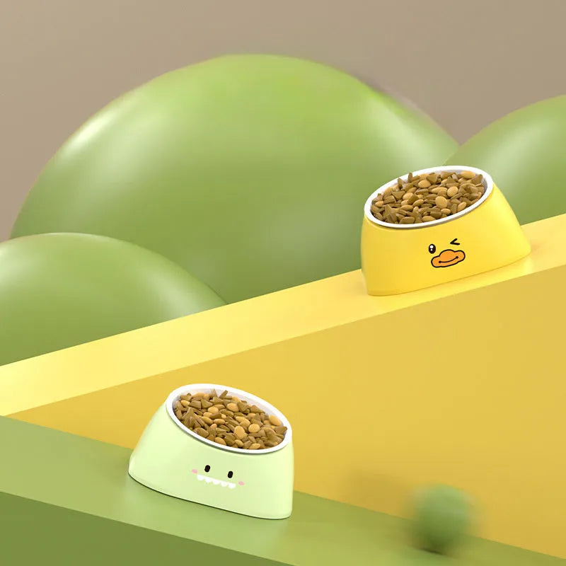 Green tilted pet bowl with stainless steel insert for cervical spine support during feeding