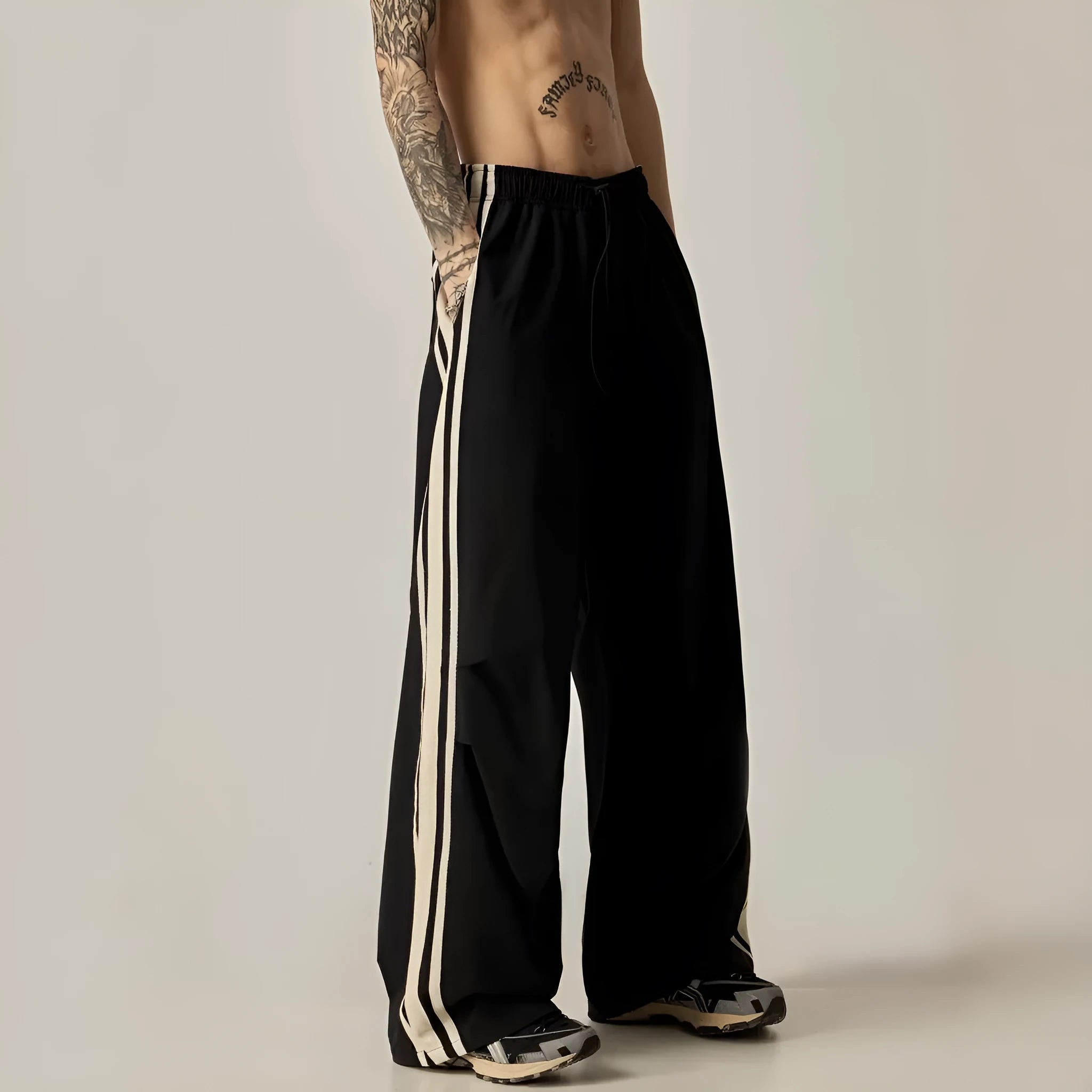 Men's black wide leg climbing trousers with high waist and straight leg design on mannequin