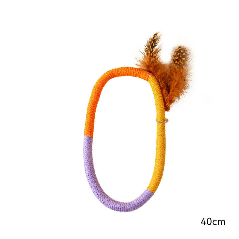 Green and purple cotton rope cat toys with feathers and catnip for interactive feline play