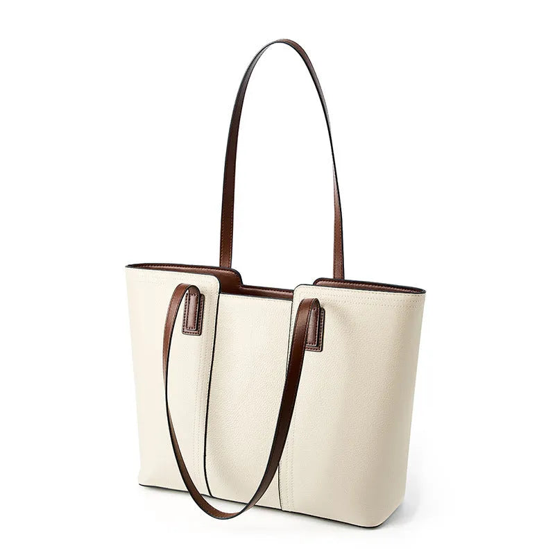 Women's black genuine leather commuter bag with crossbody strap and internal organiser pockets