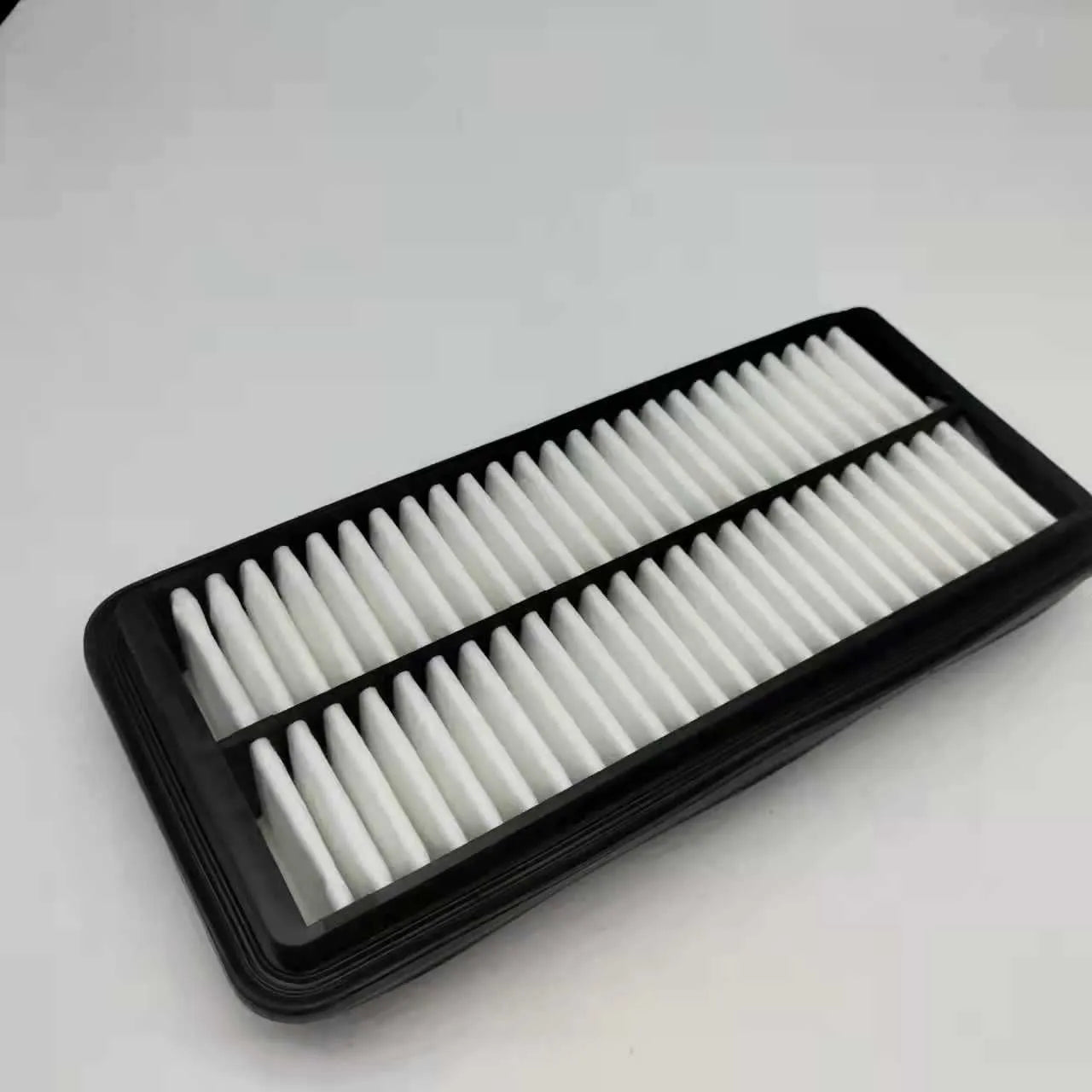 Black rectangular car air filter for Modern vehicles, dimensions 256mm by 113mm by 40mm.