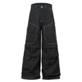 Black pleated mid-waist cotton denim jeans with multi-pocket workwear style on a hanger.