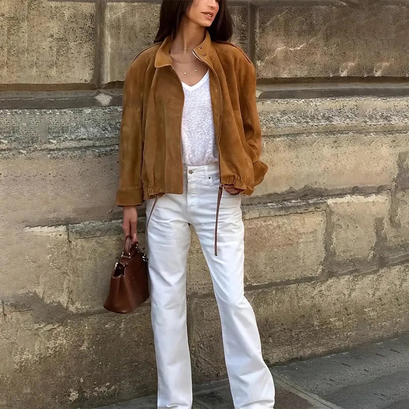 Solid colour loose-fit polyester jacket with long sleeves on a hanger
