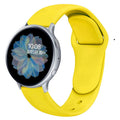 Galaxy Active 2 smartwatch with a purple silicone strap featuring a reverse buckle clasp