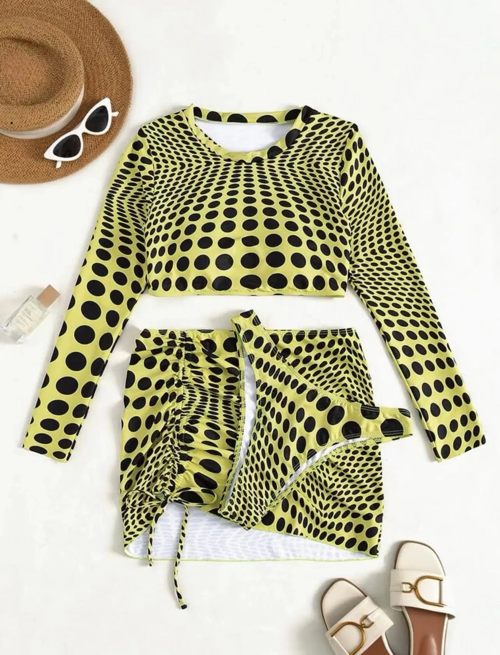 Women's green polka dot swimsuit three-piece set showing top, skirt and bra components