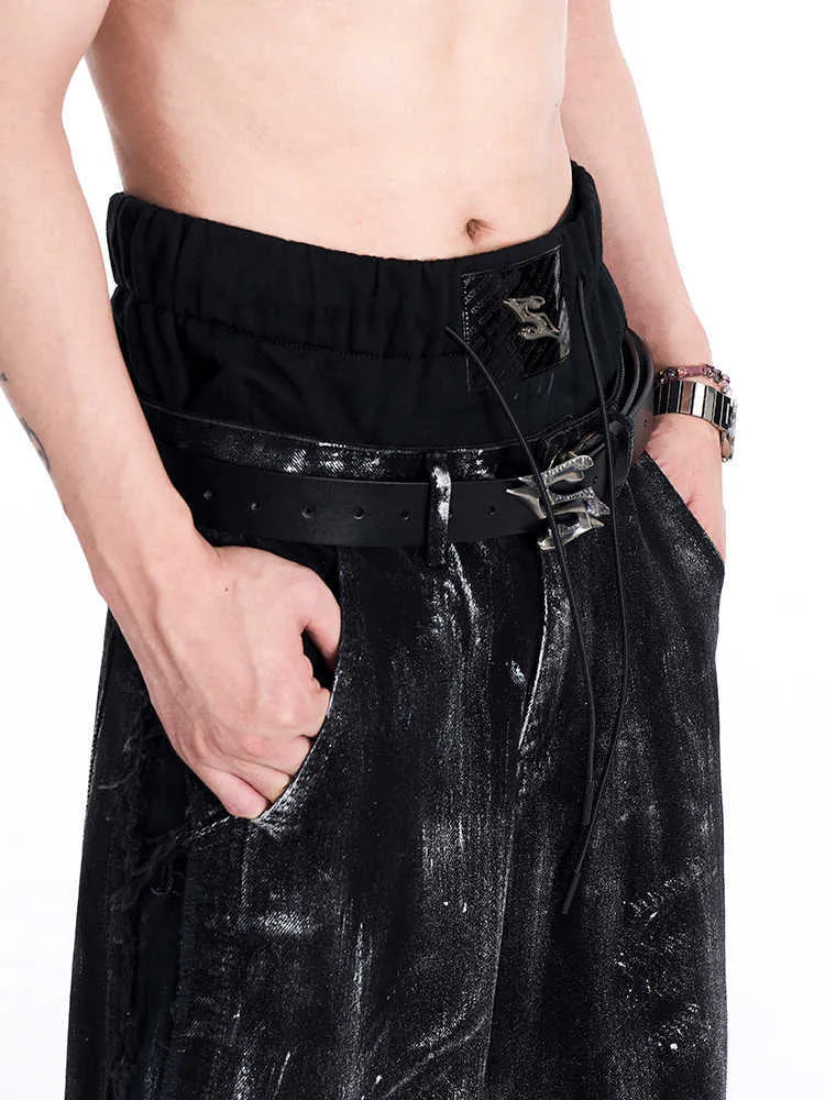 Men's black leather belt with metal letter buckle showing two-layer cowhide construction
