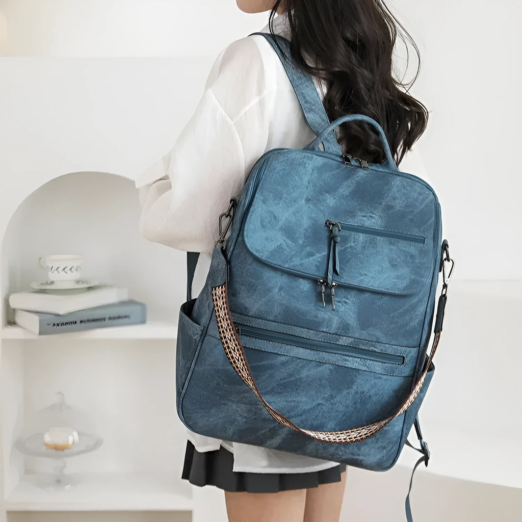 Retro solid colour college backpack with curved shoulder straps, shown in a choice of colours.