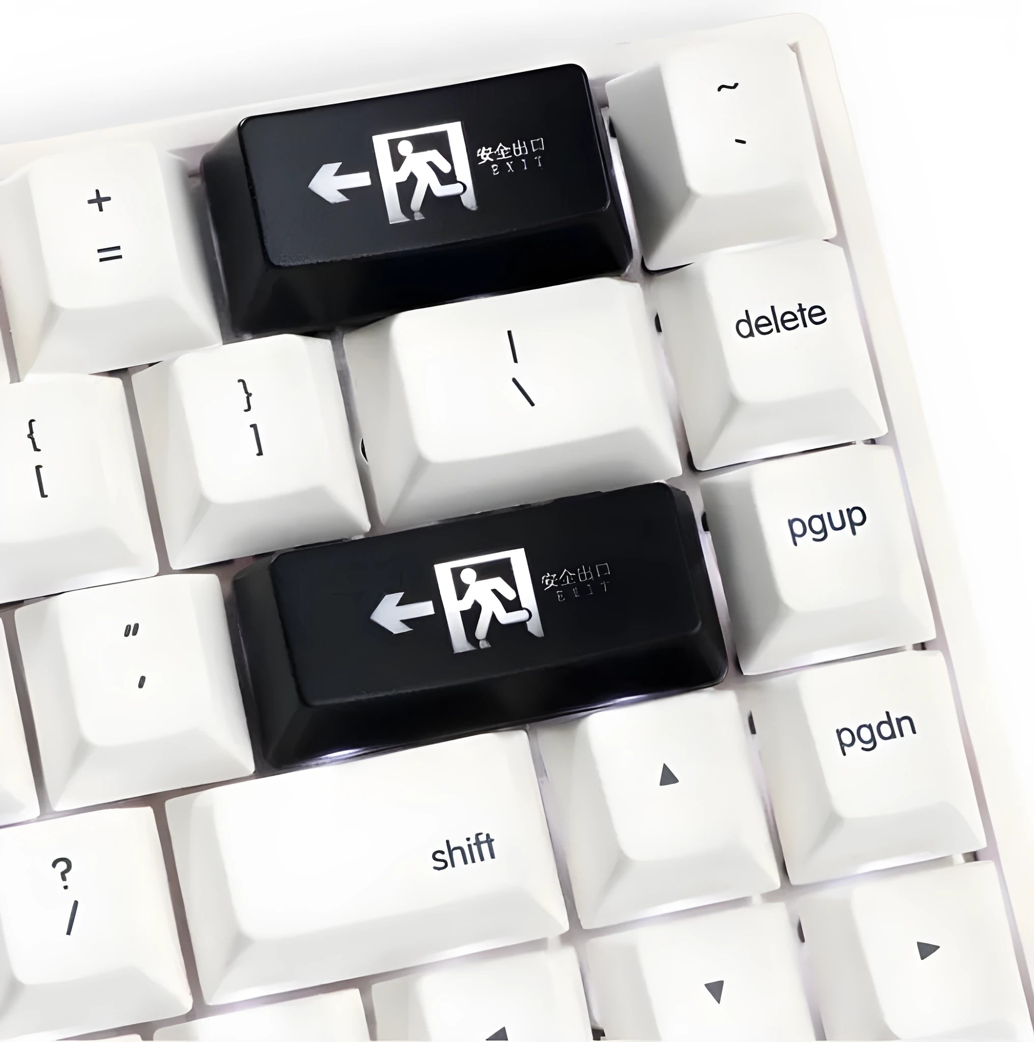 Transparent mechanical keyboard key cap with red safety evacuation exit symbol for backspace key.