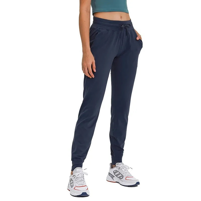 Women's high waist yoga pants with drawstring waistband in quick-drying cotton blend fabric