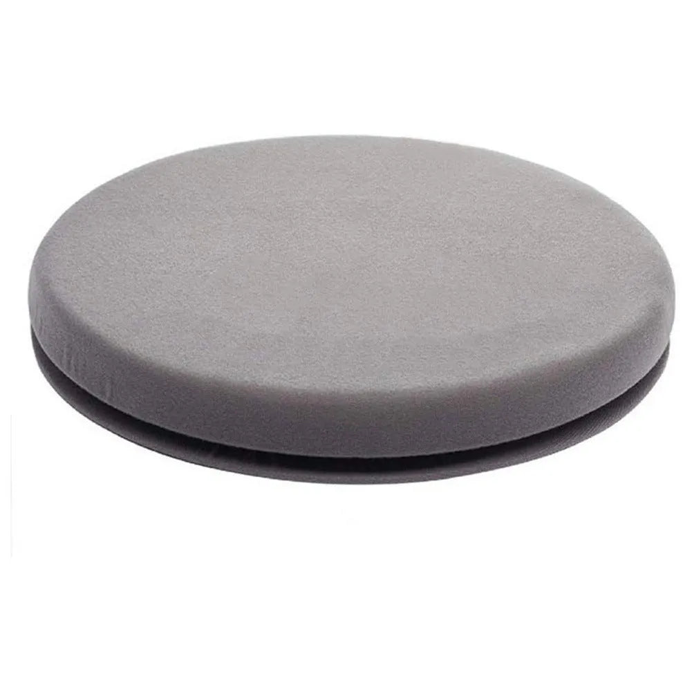 Round grey car seat cushion with a rotating base, shown on a car seat.