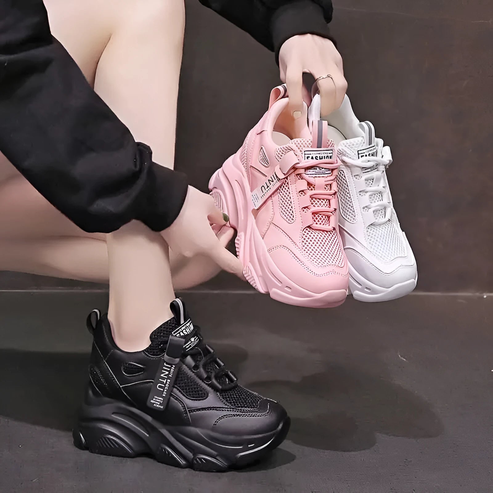 Women's black mesh platform casual shoes with hollow out details and a toe holder.