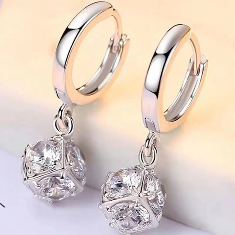 Geometric rose design copper earrings with zircon stones in an electroplated colour finish.