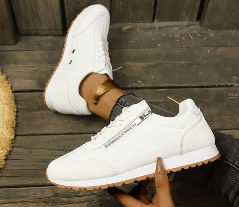 Women's flat-heeled shoes in Champagne, grey, and white with a PU upper and rubber sole.