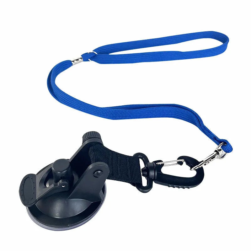 Pet bathing restraint with blue suction cups and adjustable rope securing a dog during washing