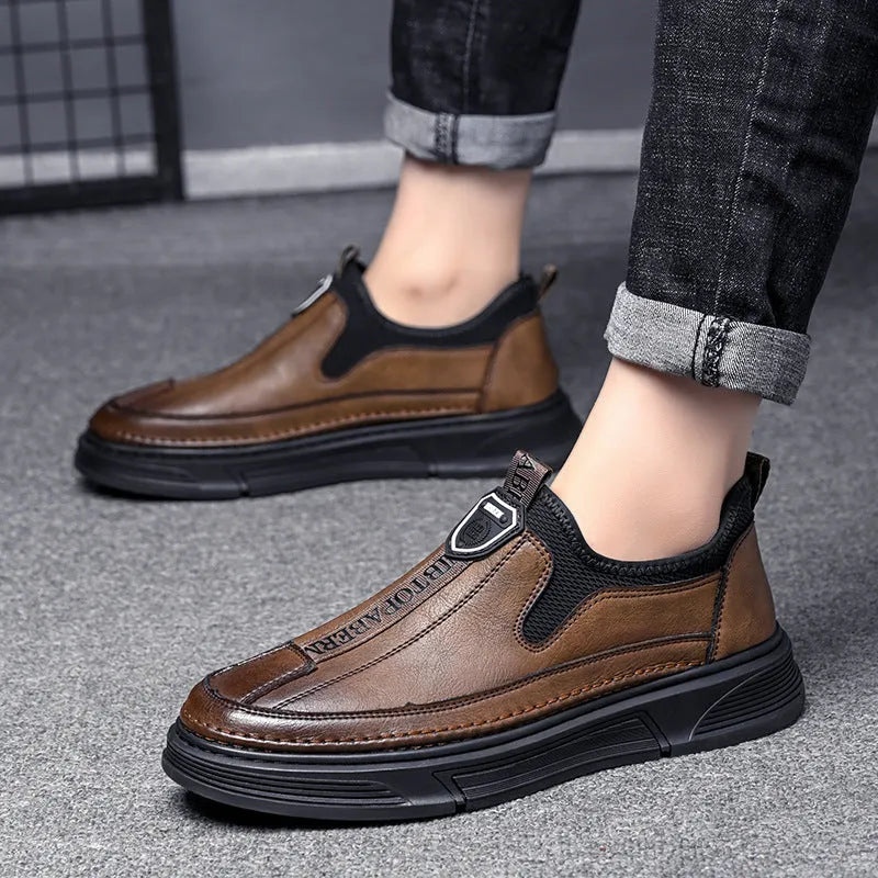 Men's solid colour leather casual shoes with round toe in Black and Brown options.