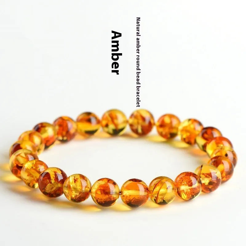 Natural yellow piebald amber bracelet with geometry beads on wrist