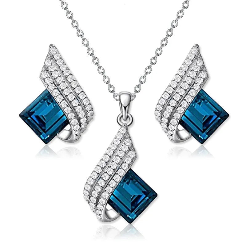 Women's alloy and glass cross chain necklace with matching electroplated stud earrings jewellery set