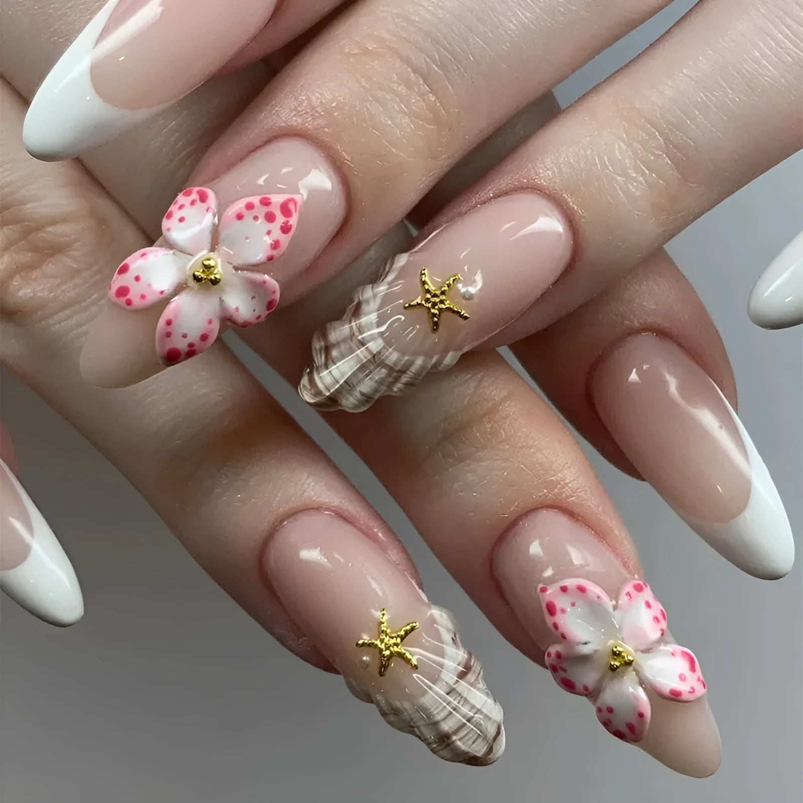 Press-on fake nails with flower French style and grey rock pattern patches on a white tip, W1764 colour.