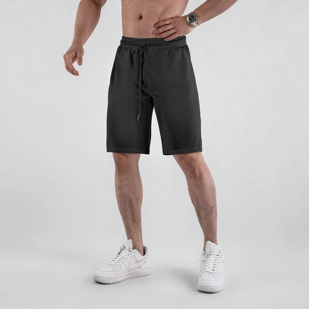 Men's black quick-drying mesh casual shorts with elastic waistband on a neutral background