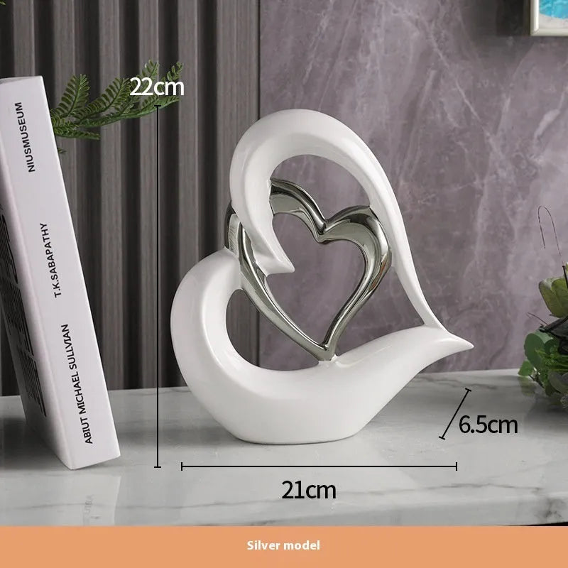 Modern white porcelain love heart ornament with a choice of metallic gold, silver and coloured finishes.
