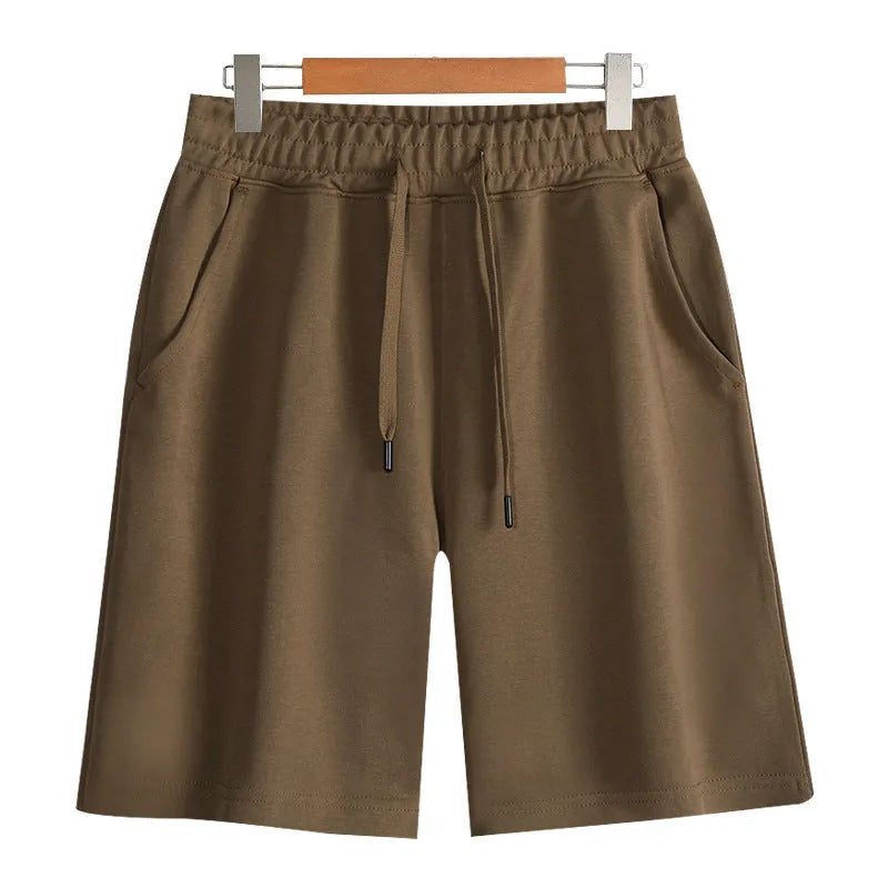Cotton straight-leg sports shorts in light grey colour showing micro-elastic fabric and fifth pants length