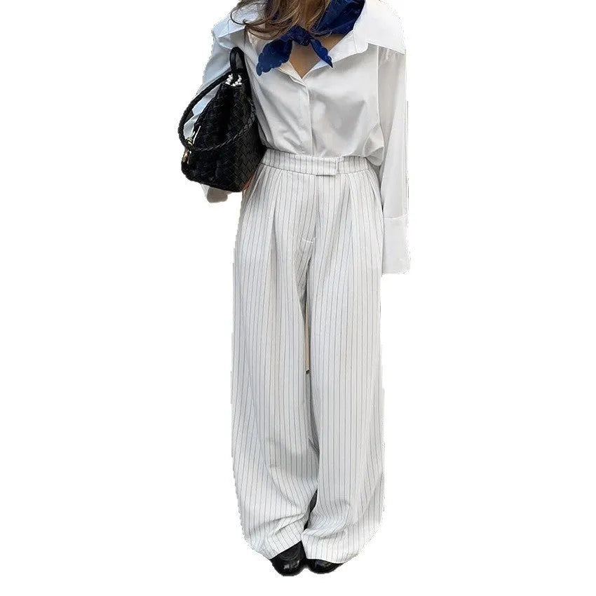 White striped wide-leg commuting trousers with zip closure on Asian-sized mannequin