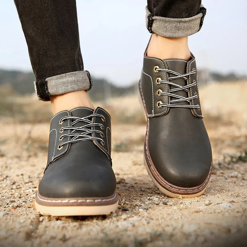 Men's black mid-top tide British leather boots with a flat style and rubber sole