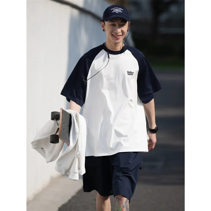 Japanese-style raglan sleeve t-shirt in blue, green, and grey colours with loose fit design