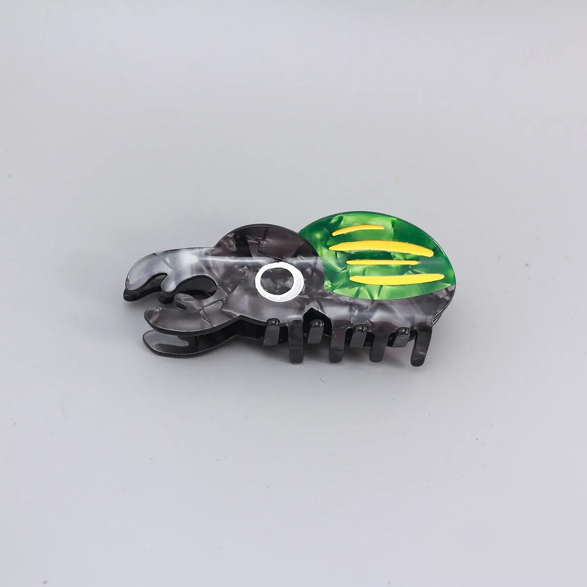 Handmade cellulose acetate Beetle Grip insect biology teaching tool with cartoon caterpillar design