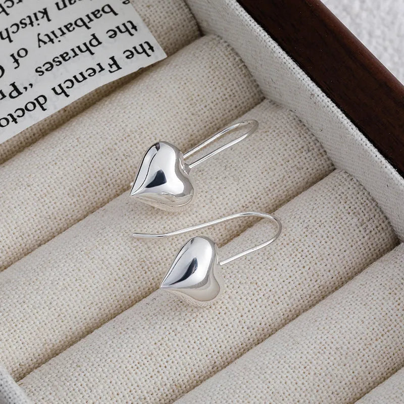 Korean style 3D heart-shaped earrings with glossy finish and silver colour