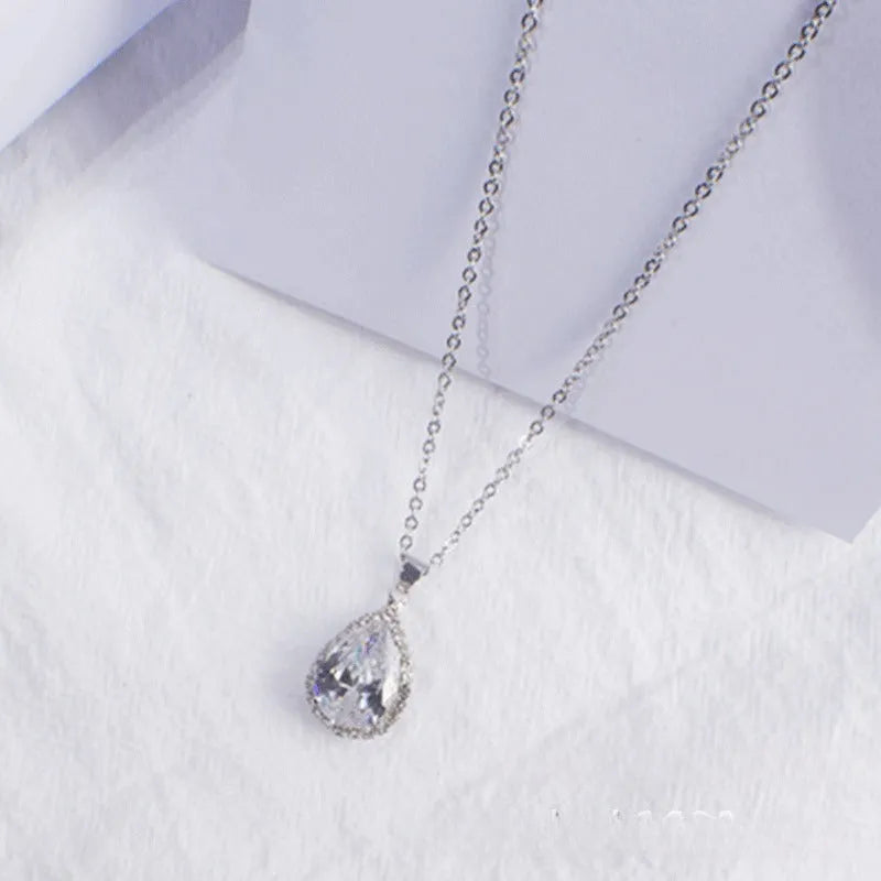 Women's water drop necklace with rose gold rhinestone and pink alloy gemstone pendant.