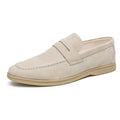 Men's leather slip-on casual shoes in beige with a rounded toe and rubber sole.