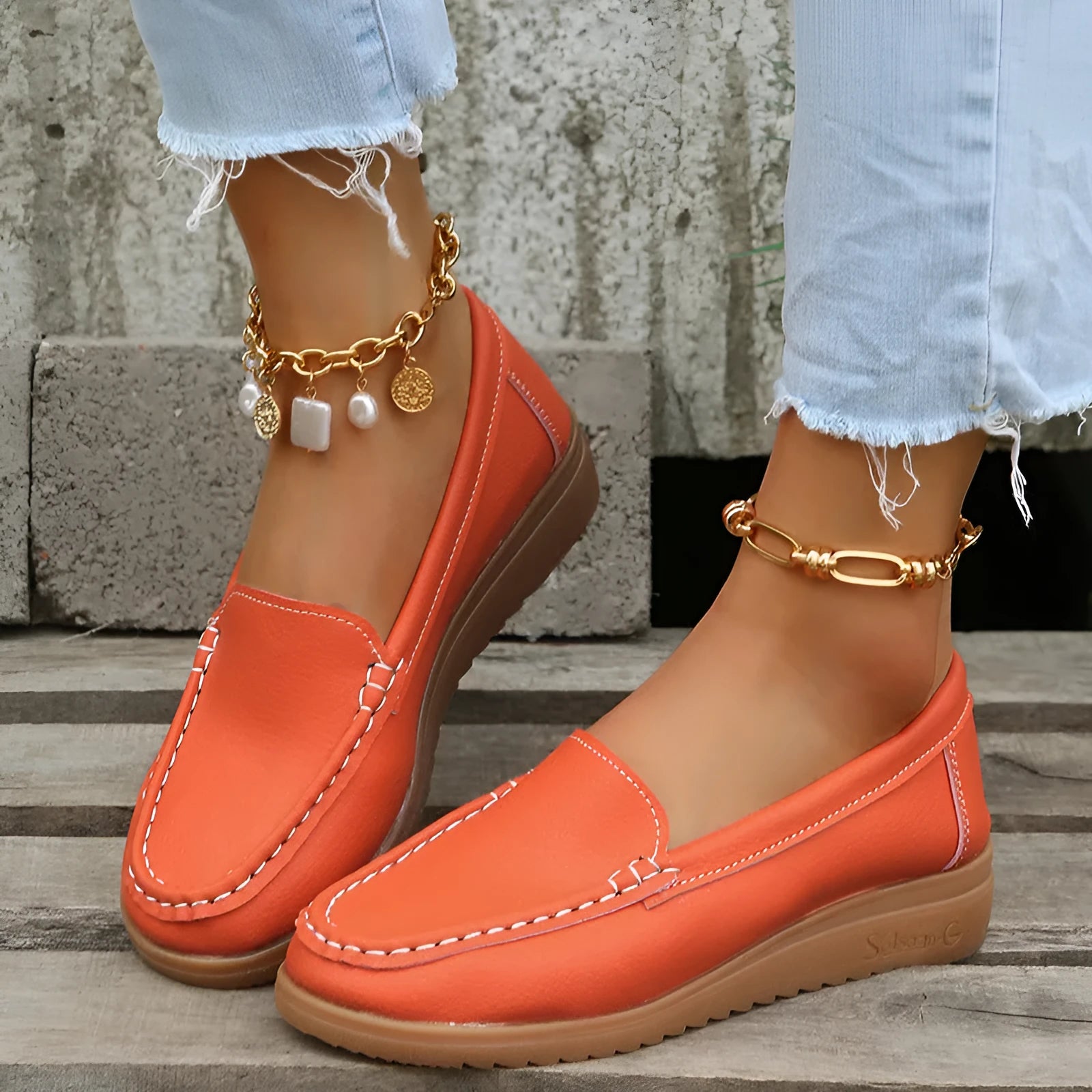 Women's PU leather flat loafers in multiple colours with round toe and car suture detail.
