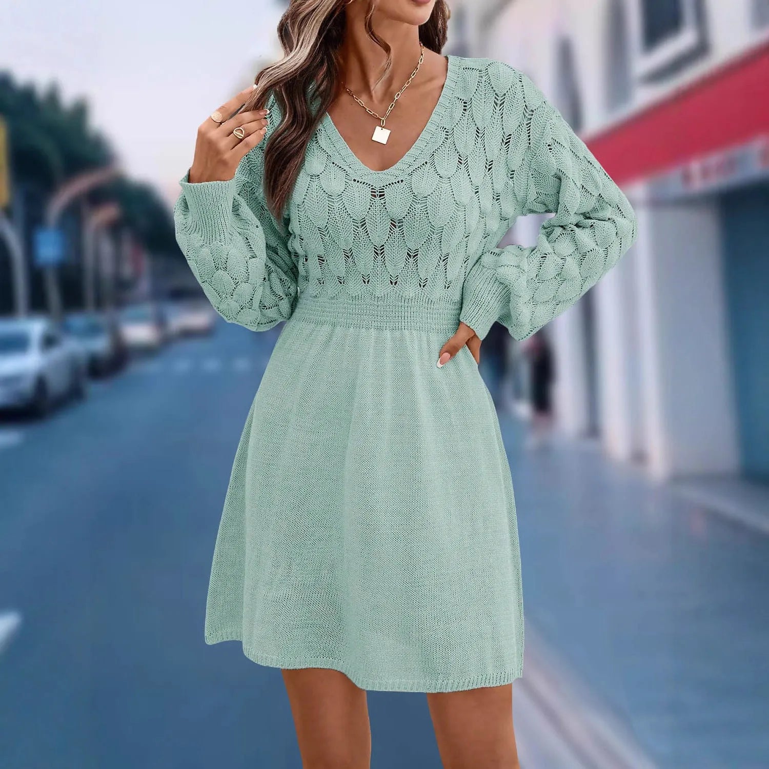 Apricot coloured V-neck long sleeve dress with a high waist and 3D pattern details.