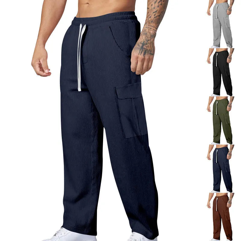 Men's loose-fitting corduroy cargo trousers in a straight-leg design with a drawstring waist.