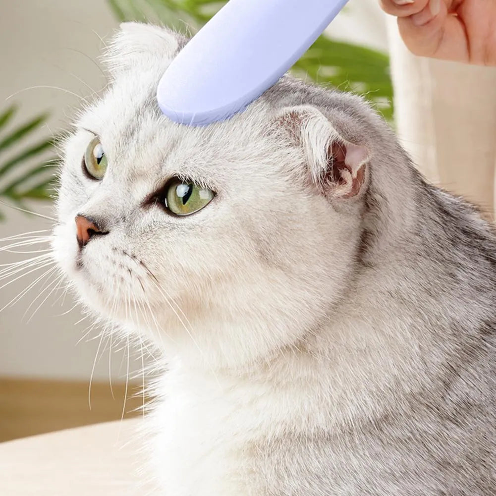 Grey and pink ABS cat grooming comb with tongue massage design and dual-ended grooming surfaces