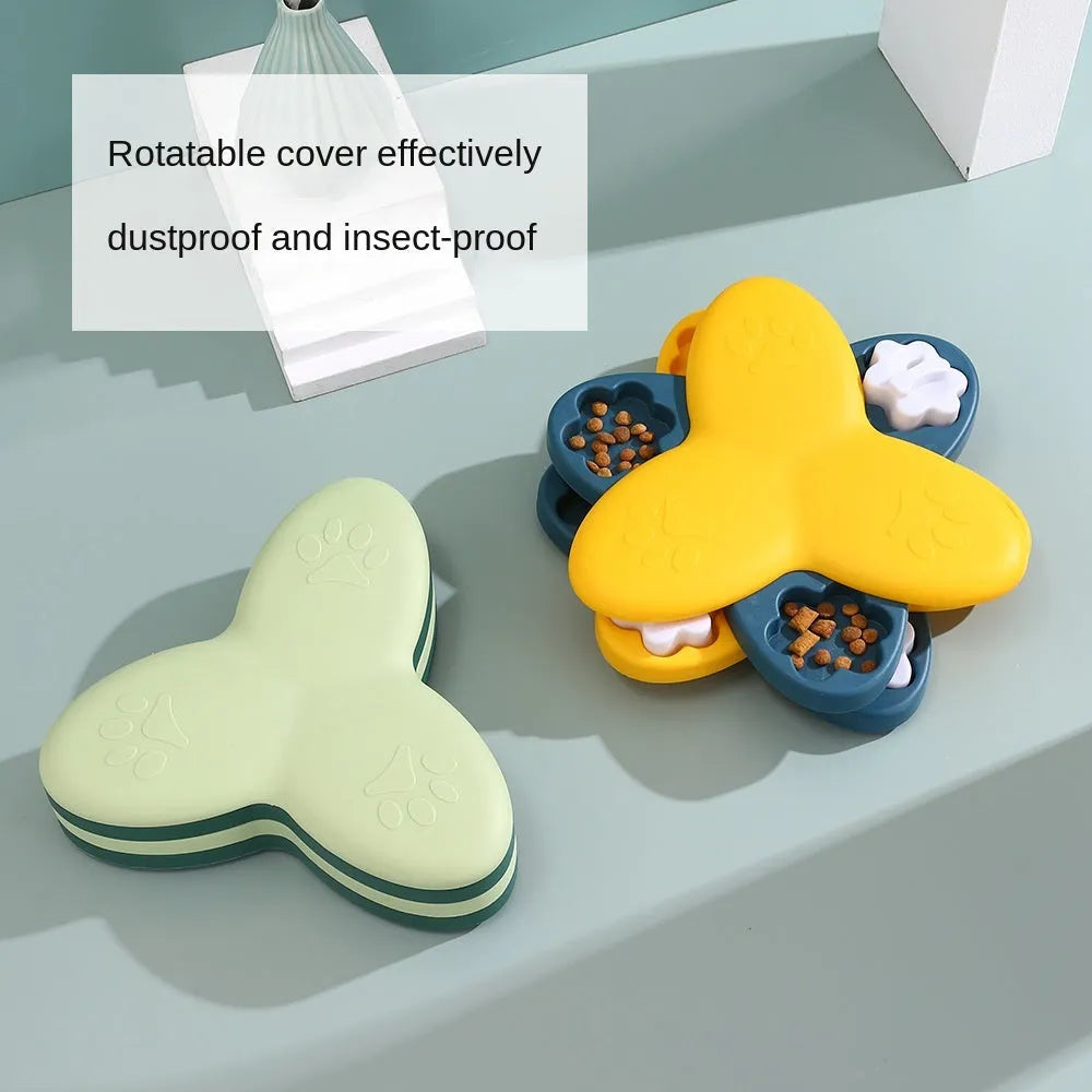 Green and yellow dog puzzle toy with rotatable compartments and bone-shaped covers